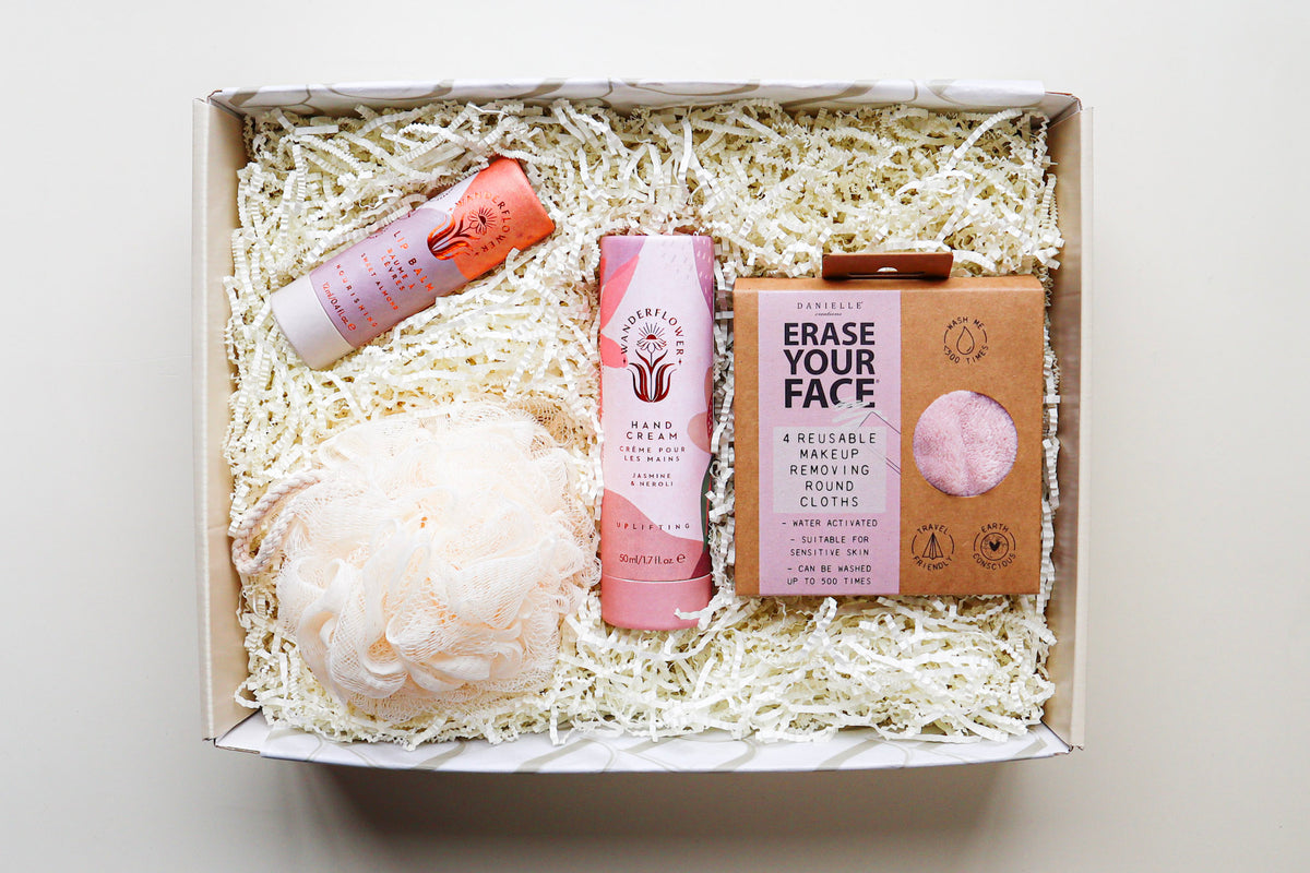 Revive Gift Box contains pink coordinated items including a Wanderflower Handcream and Lip Balm, a pack of 4 Erase Your Face Reuseable Make Up Removing Round Cloths and a Cream Bath Exfoliating Puff